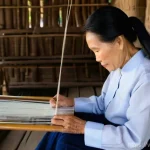 이단 연구 기관의 역할 - **Cultural Preservation through Traditional Craftsmanship**
    An elderly Vietnamese woman, with ki...